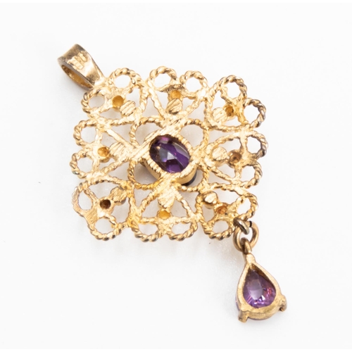 27 - Oval and Pear Cut Amethyst Set Filigree Form Pendant Attractively Detailed Mounted in 9 Carat Yellow... 