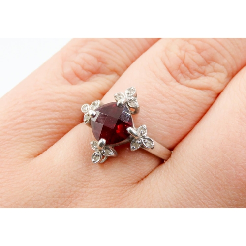 289 - Facet Cut Red Garnet Centre Stone Ring Finely Detailed Diamond Surround Mounted in 9 Carat White Gol... 