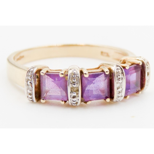 291 - Three Stone Amethyst and Diamond Set Ladies Ring Mounted in 9 Carat Yellow Gold Ring Size P