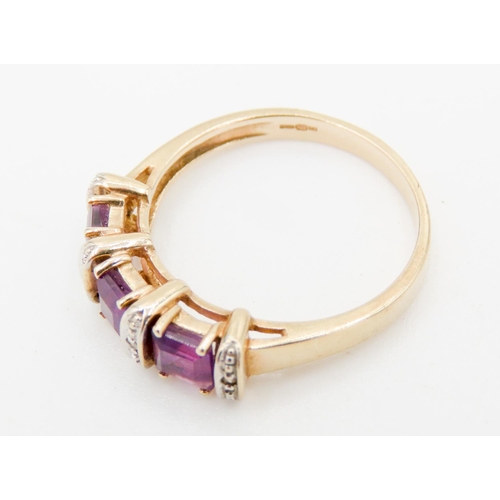 291 - Three Stone Amethyst and Diamond Set Ladies Ring Mounted in 9 Carat Yellow Gold Ring Size P