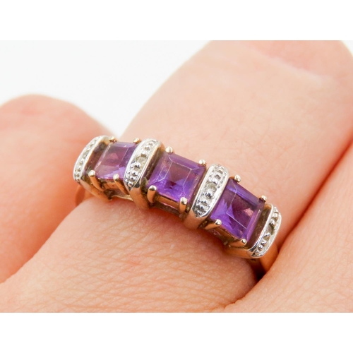 291 - Three Stone Amethyst and Diamond Set Ladies Ring Mounted in 9 Carat Yellow Gold Ring Size P