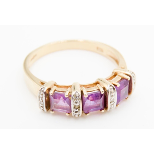 291 - Three Stone Amethyst and Diamond Set Ladies Ring Mounted in 9 Carat Yellow Gold Ring Size P