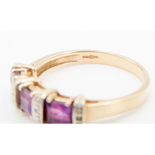 291 - Three Stone Amethyst and Diamond Set Ladies Ring Mounted in 9 Carat Yellow Gold Ring Size P