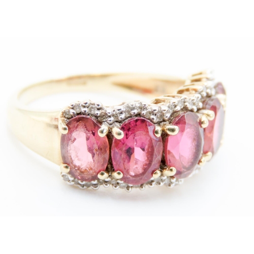 298 - Five Stone Oval Cut Pink Spinel Ring Mounted in 9 Carat Yellow Gold Further Diamond Set Surround Rin... 