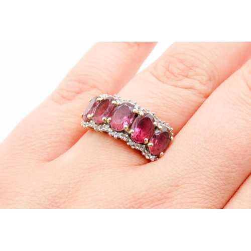 298 - Five Stone Oval Cut Pink Spinel Ring Mounted in 9 Carat Yellow Gold Further Diamond Set Surround Rin... 