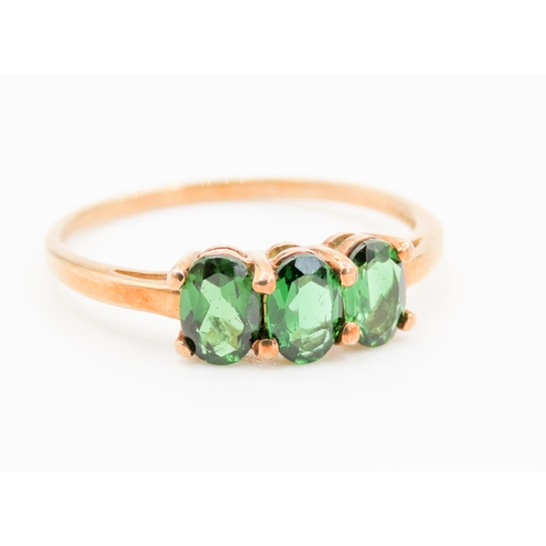 306 - Three Stone Diopside Set Ring Mounted in 9 Carat Yellow Gold Ring Size S