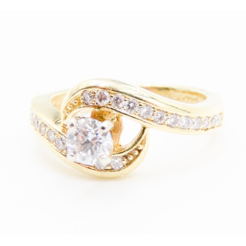 308 - Four Claw Set Diamond Swirl Motif Solitaire Ring further Diamonds Set to Band Mounted in 18 Carat Ye... 