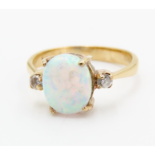 310 - Four Claw Set Opal Ring Mounted in 9 Carat Yellow Gold further Gemstone Set to Shoulders Ring Size Q