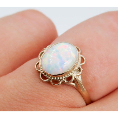 329 - Opal Single Stone Ring Finely Detailed Hollow Petal Surround Mounted in 9 Carat Yellow Gold Ring Siz... 