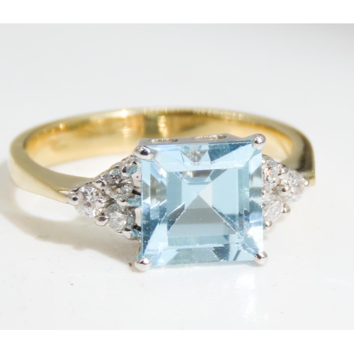 334 - Square Cut Aquamarine Centre Stone Ring  Basket set in 18 Carat Yellow Gold Further Diamond Clusters... 