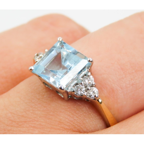 334 - Square Cut Aquamarine Centre Stone Ring  Basket set in 18 Carat Yellow Gold Further Diamond Clusters... 