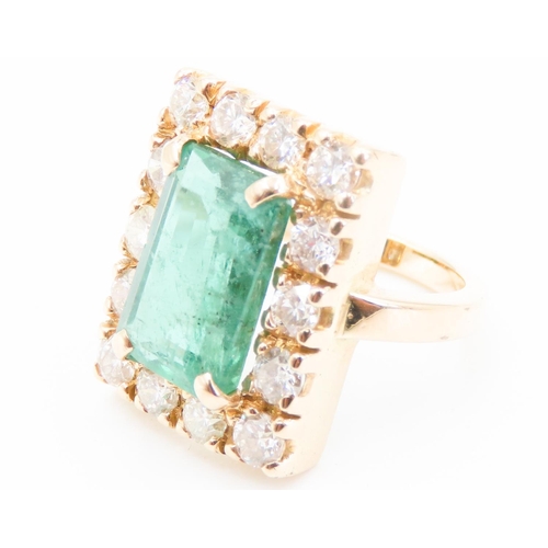 373 - Emerald and Fourteen Diamond Set Ladies Ring Mounted in 18 Carat Yellow Gold Total Emerald Carat Wei... 