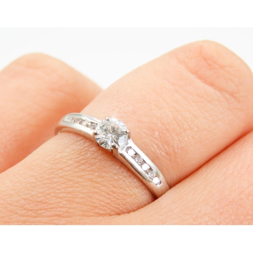 432 - Four Claw Set Diamond Solitaire Ring Further Diamonds Bar Set to Shoulder Mounted in 18 Carat white ... 