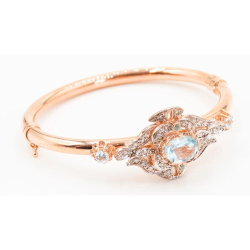 437 - 9 Carat Rose Gold Aquamarine Set Ladies Bangle Further Decorated with Diamonds Inner Width 6.5cm