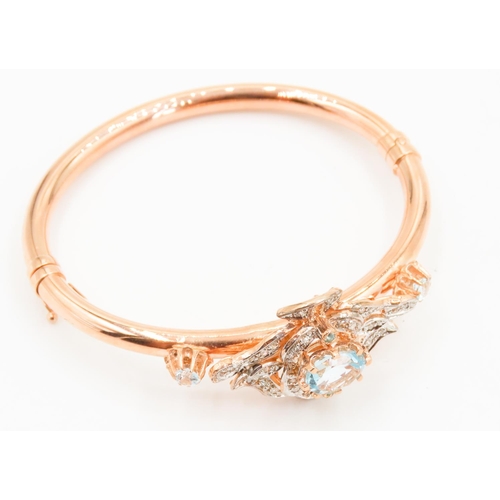 437 - 9 Carat Rose Gold Aquamarine Set Ladies Bangle Further Decorated with Diamonds Inner Width 6.5cm