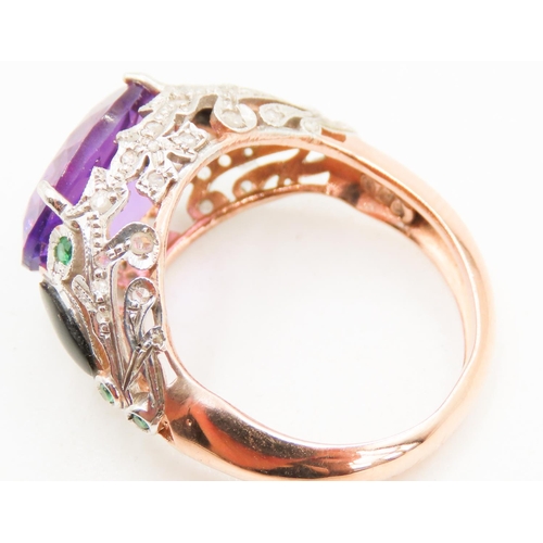 439 - Amethyst Four Claw Set Ladies Ring Diamond Decorated Surrounds with Inset Emeralds 9 Carat Rose Gold... 