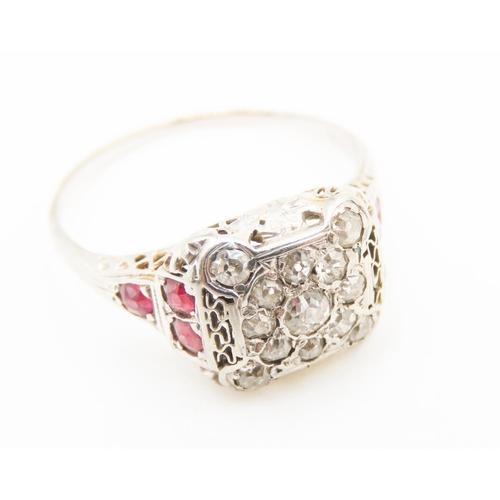 445 - Unusual Form Ladies Diamond and Ruby Set Ring Mounted in 18 Carat White Gold Ring Size R