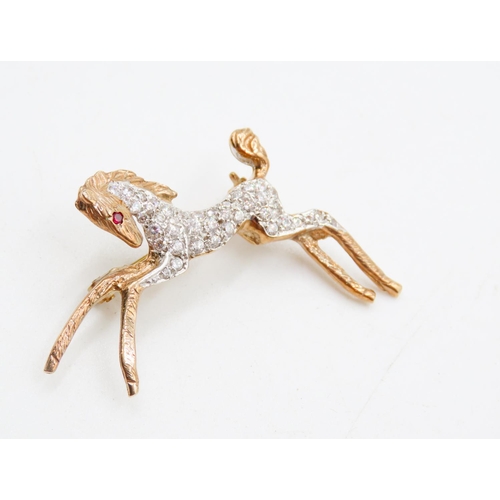 460 - Ruby and Gemstone Set 9 Carat Yellow Gold Horse Brooch 4cm Wide