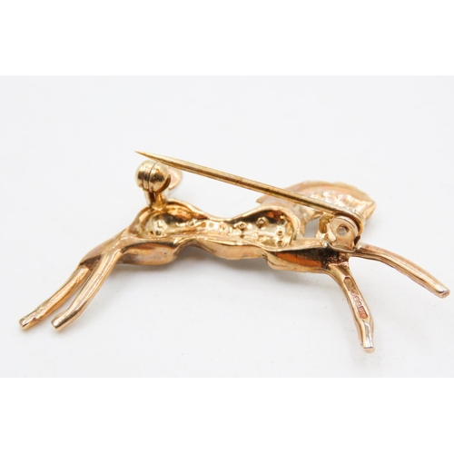 460 - Ruby and Gemstone Set 9 Carat Yellow Gold Horse Brooch 4cm Wide