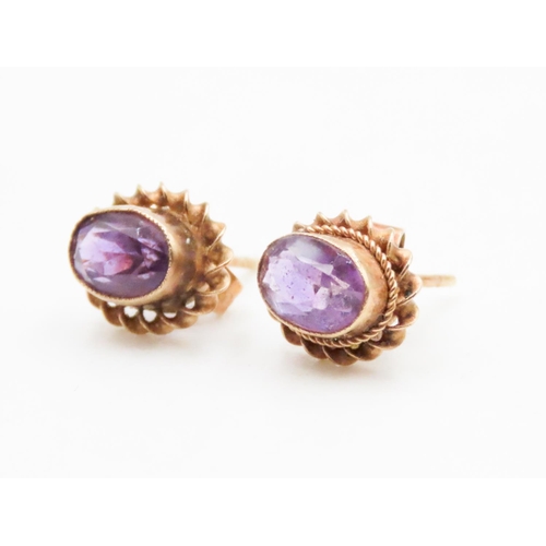 553 - Pair of Bezel Set Amethyst Earrings Set in 9 Carat Yellow Gold Rope Form Edge 1cm High Each