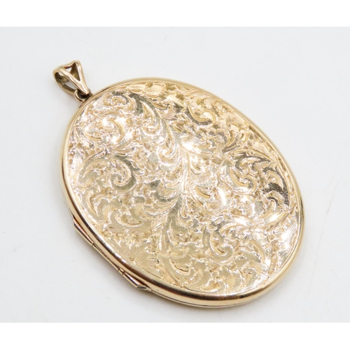 580 - Large 9 Carat Yellow Gold Locket Pendant Incised Floral Detailing 5cm High