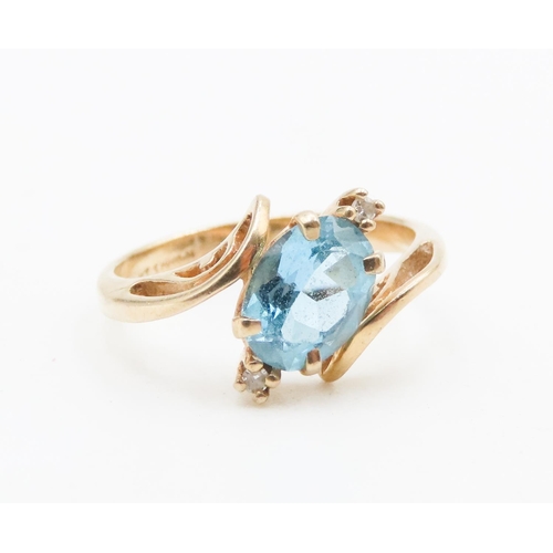 583 - Oval Cut Blue Topaz and Diamond Set Ladies Wrap Around Form Ring Mounted in 14 Carat Yellow Gold Rin... 