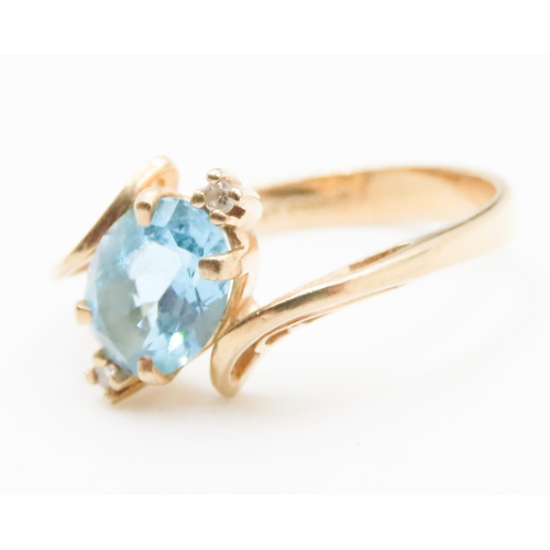 583 - Oval Cut Blue Topaz and Diamond Set Ladies Wrap Around Form Ring Mounted in 14 Carat Yellow Gold Rin... 