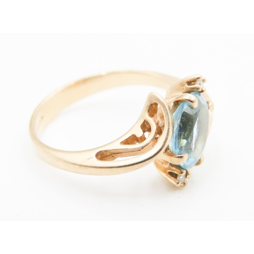 583 - Oval Cut Blue Topaz and Diamond Set Ladies Wrap Around Form Ring Mounted in 14 Carat Yellow Gold Rin... 