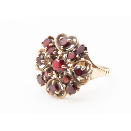 584 - Red Garnet Set Ladies Cluster Ring Heart Motifs Mounted in 9 Carat Yellow Gold Ring Size Q