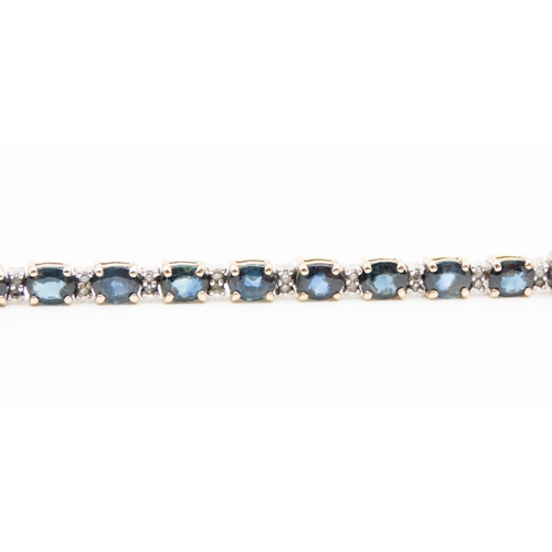 590 - Sapphire Twenty Five Stone Set Bracelet with Further Diamond Inset Mounted in 14 Carat Yellow Gold 1... 