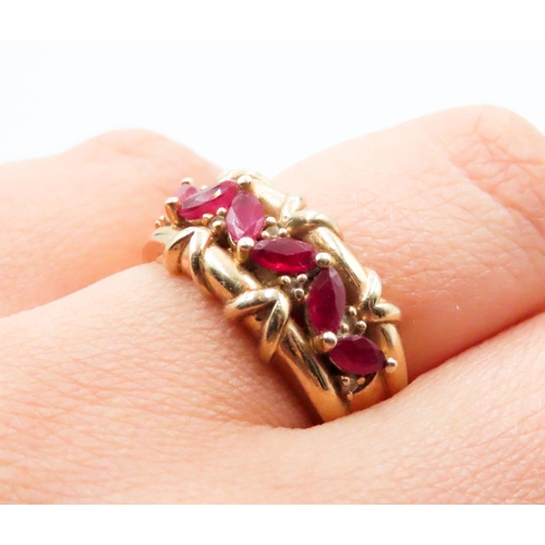 597 - Six Stone Ruby Ring with Further Diamond Inset Finely Detailed Set in 14 Carat Yellow Gold Ring Size... 