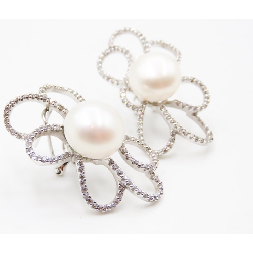 601 - Unusual Form Pearl and Diamond Set Petal Form Earrings Mounted in 14 Carat White Gold 3.5cm High