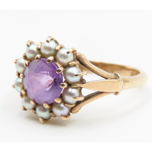 604 - Amethyst and Seed Pearl Daisy Form Ring Mounted in 9 Carat Yellow Gold Ring Size J and a Half