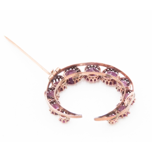 605 - Amethyst Eleven Stone Graduated Form Crescent Brooch Set in 9 Carat Rose Gold 3cm Wide