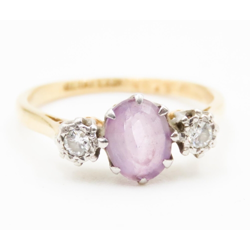 621 - Amethyst and Diamond Set Three Stone Rind Mounted in 18 Carat Yellow Gold Ring Size P and a Half