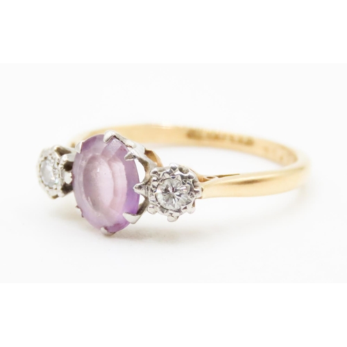 621 - Amethyst and Diamond Set Three Stone Rind Mounted in 18 Carat Yellow Gold Ring Size P and a Half