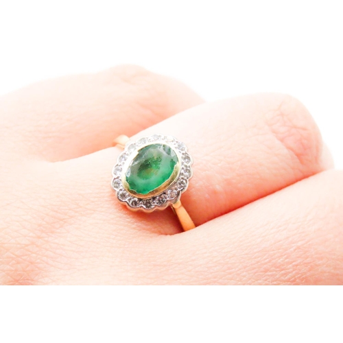 625 - Bezel Set Oval Cut Emerald Centre Stone Ring Diamond Set Halo Surround Mounted in 18 Carat Yellow Go... 