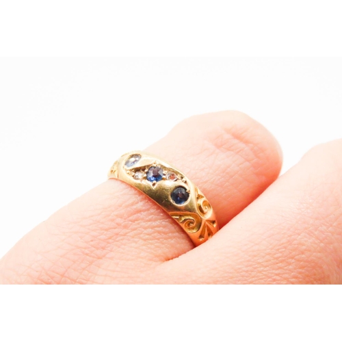 631 - Sapphire Three Stone Ring with Further Diamond Inset Mounted in 18 Carat Yellow Gold incised Detail ... 