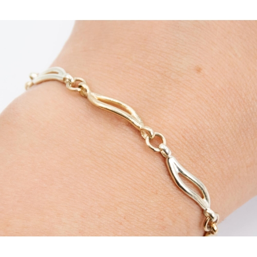 75 - 9 Carat Yellow and White Gold Wave Link Bracelet 20cm Long