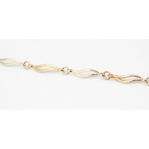 75 - 9 Carat Yellow and White Gold Wave Link Bracelet 20cm Long