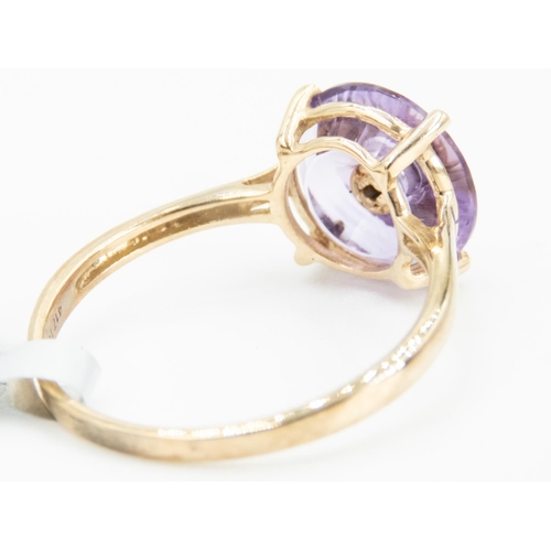 98 - Unusual Form Amethyst Set Ring with Diamond Inset to Centre Mounted in 9 Carat Yellow Gold Ring Size... 