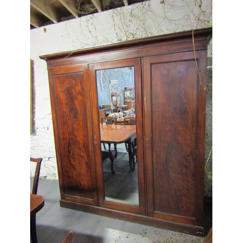 1089 - William IV Figured Mahogany Three Door Wardrobe Mirrored Central Section Approximately 6ft 6 Inches ... 