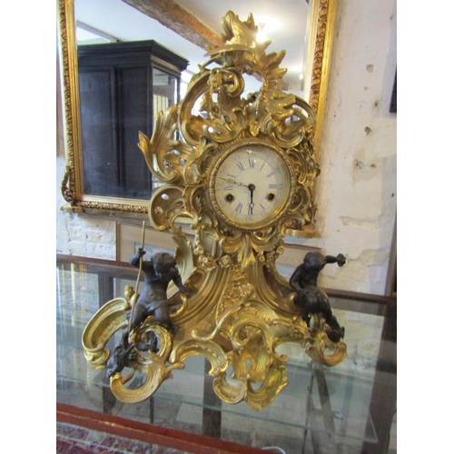 1122 - Antique Ormolu Rocco Form Table Clock Attractively Detailed with Cherub Motif Appliques Roman Numera... 