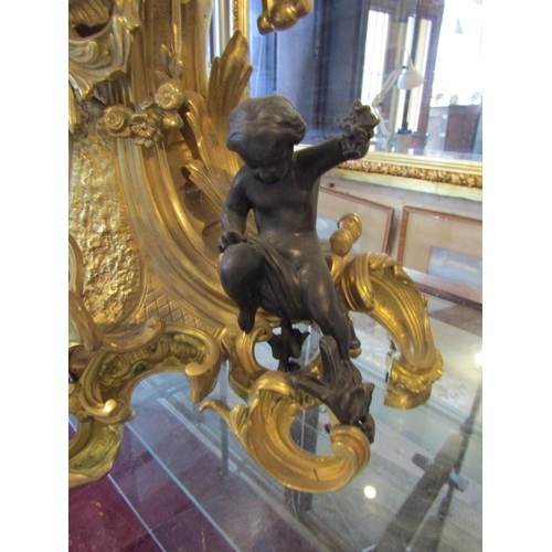 1122 - Antique Ormolu Rocco Form Table Clock Attractively Detailed with Cherub Motif Appliques Roman Numera... 