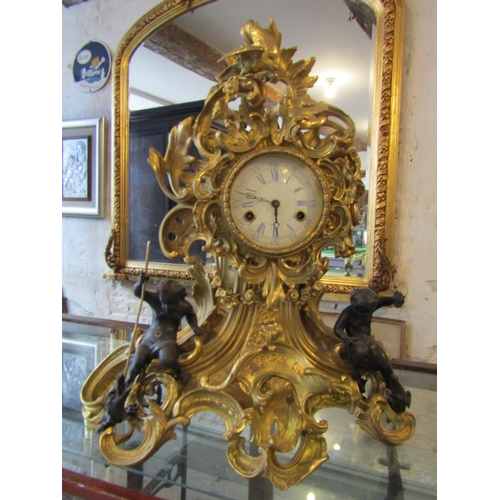 1122 - Antique Ormolu Rocco Form Table Clock Attractively Detailed with Cherub Motif Appliques Roman Numera... 