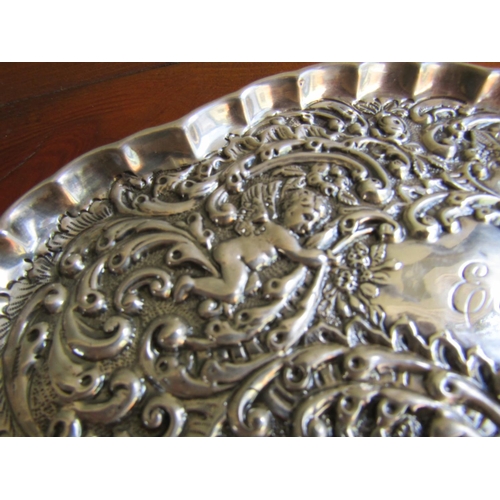 892 - Silver Table Dish Embossed Decoration Cherub Motifs Shaped Form 7 Inches Wide