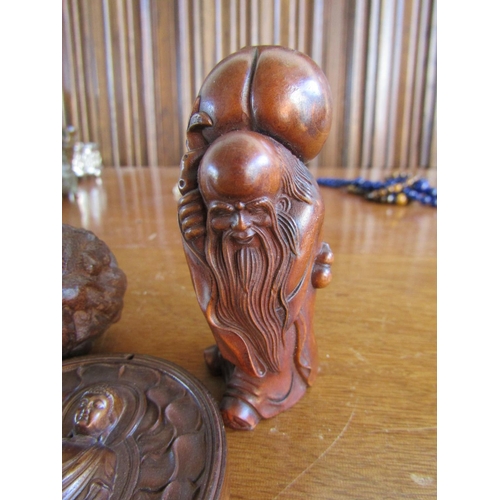 897 - Three Carved Wood Oriental Netsuke Figures Largest 6 cm High