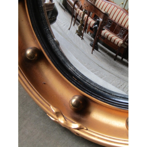 2062 - Gilded Convex Mirror with Upper Eagle Surmount Approximately 20 Inches High x 16 Inches Wide