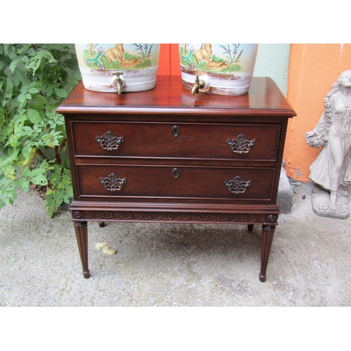 2070 - Twin Drawer Mahogany Side Chest Crossbanded Top above Tapering Reeded Supports Approximately 32 Inch... 