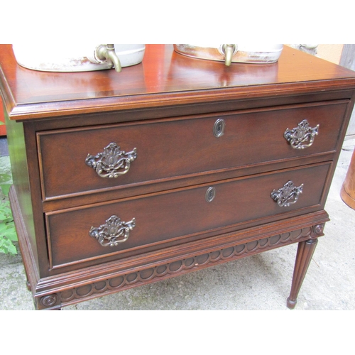 2070 - Twin Drawer Mahogany Side Chest Crossbanded Top above Tapering Reeded Supports Approximately 32 Inch... 